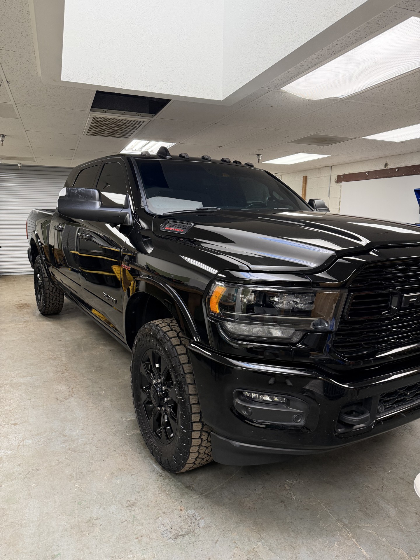 Glossy black Ram truck at Bodega Details